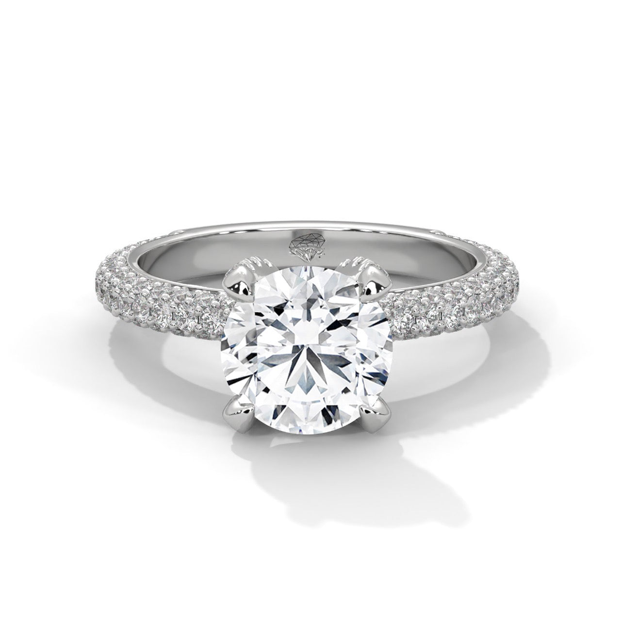 A round brilliant cut diamond ring with a triple row pavé band, displayed on a white background.