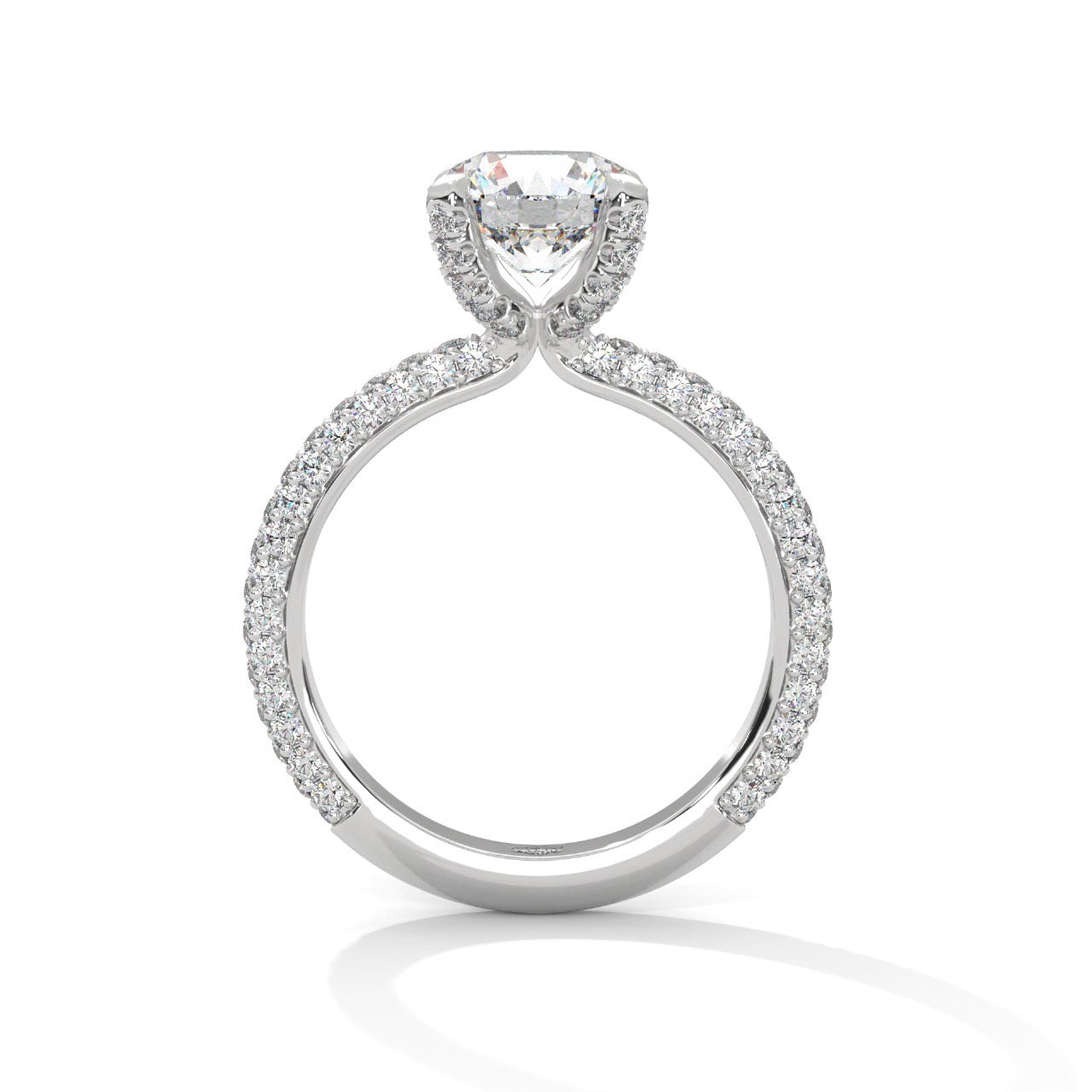 a diamond ring with three way pave band on a plain background