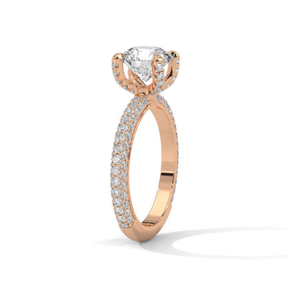 a diamond ring with three way pave band on a plain background