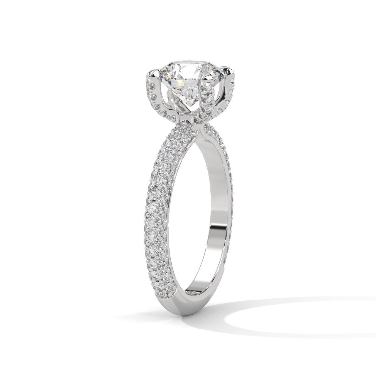 a diamond ring with three way pave band on a plain background