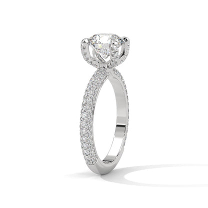 a diamond ring with three way pave band on a plain background