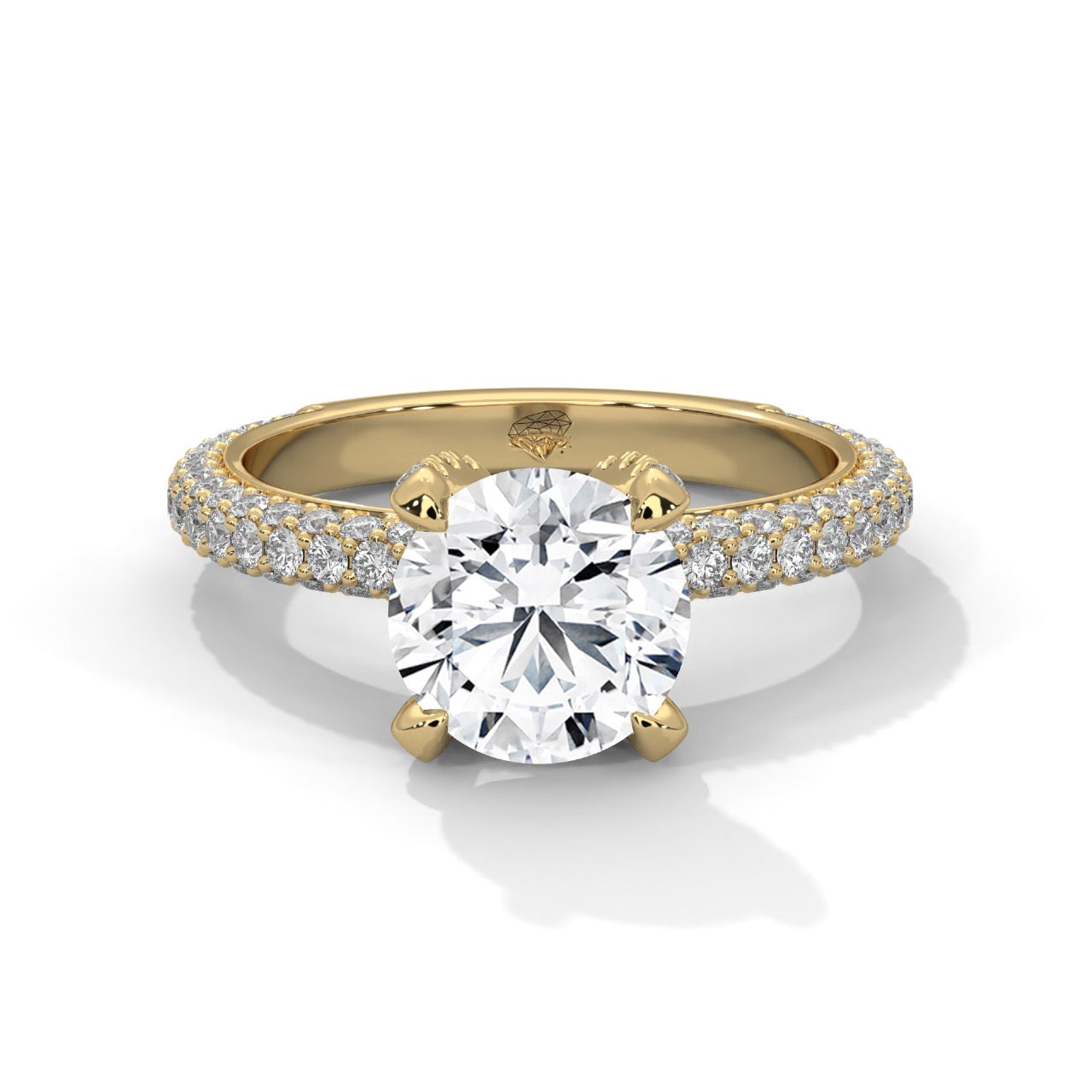 a diamond ring with three way pave band on a plain background