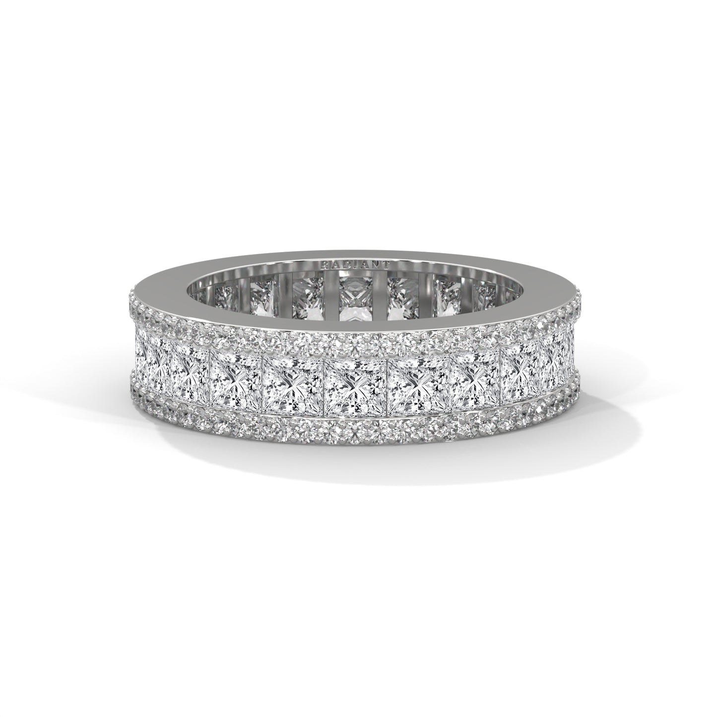 A wedding band featuring princess and round diamonds set in a metal ring.
