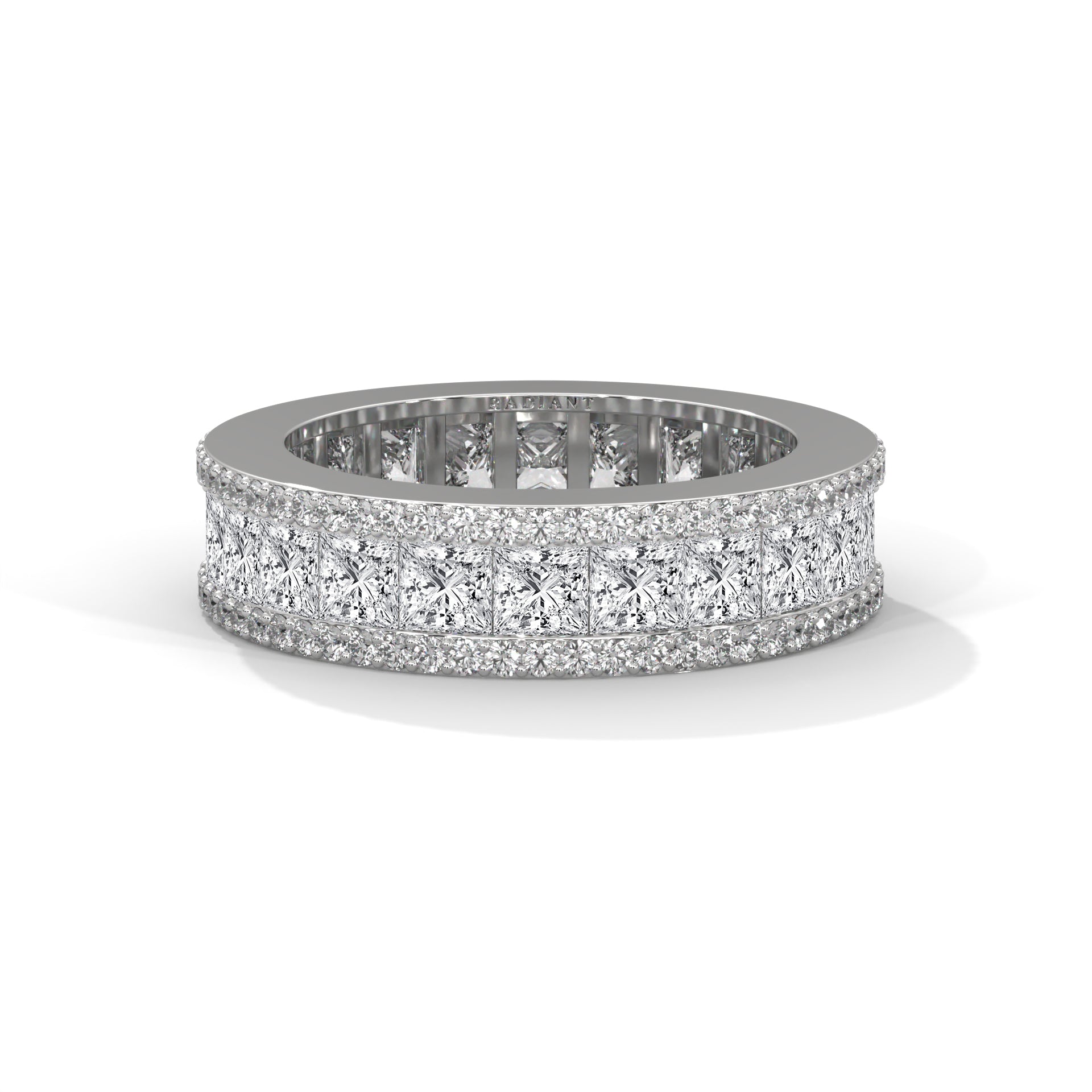 A wedding band featuring princess and round diamonds set in a metal ring.