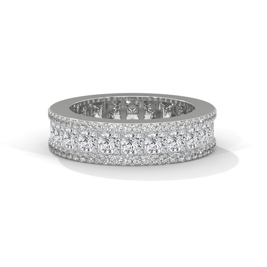 A wedding band featuring princess and round diamonds set in a metal ring.