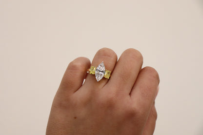Marquise ring in Trilogy Style with vivd yellow radiants on the side