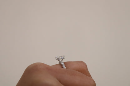hand wearing a radiant cut diamond ring 