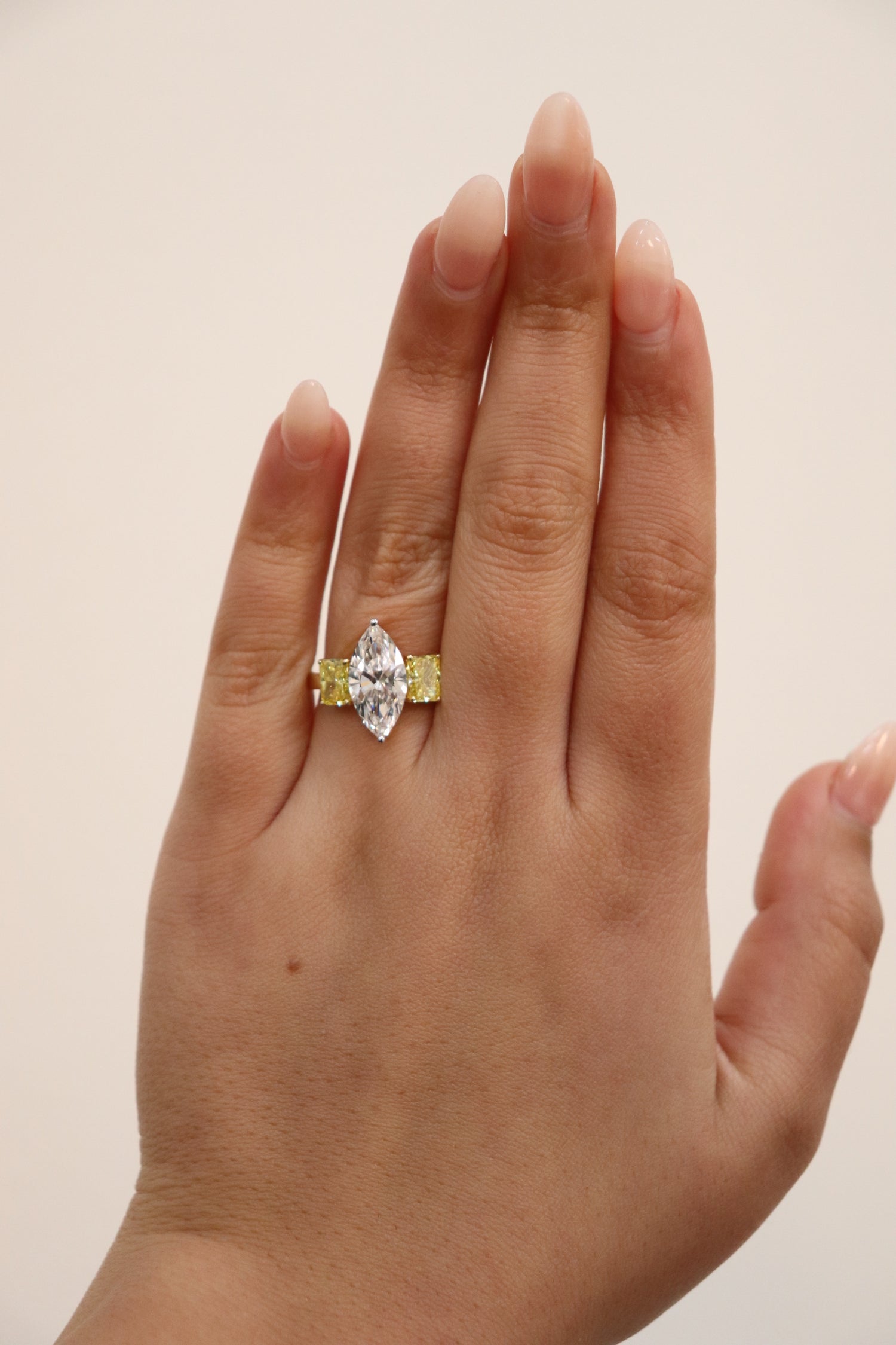 Marquise ring in Trilogy Style with vivd yellow radiants on the side