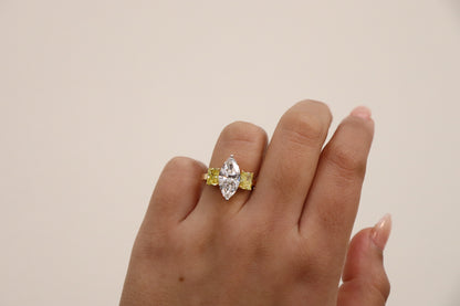 Marquise ring in Trilogy Style with vivd yellow radiants on the side