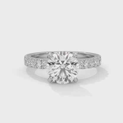 April - Classic Round Solitaire with French Pavé Band